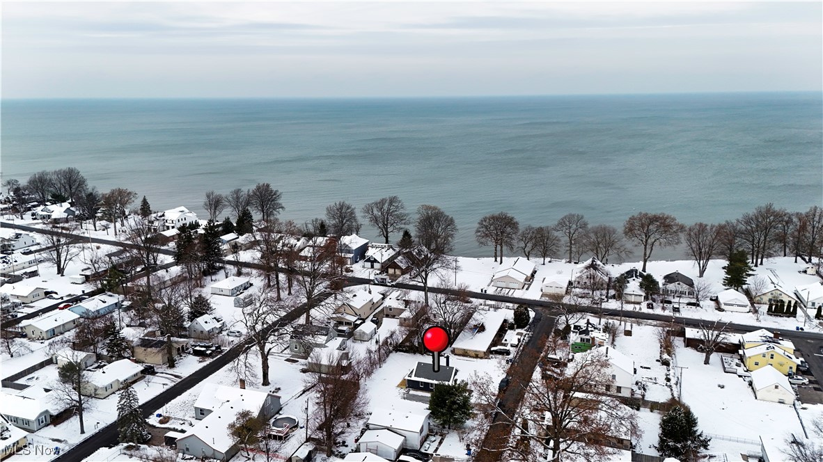 218 Roxboro Road Vermilion, OH 44089 - Photo 42 of 50 Snowy aerial view with a residential view and a water view