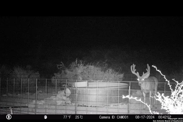 a view of swimming pool with outdoor seating
