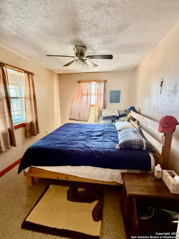 a bedroom with a bed and window