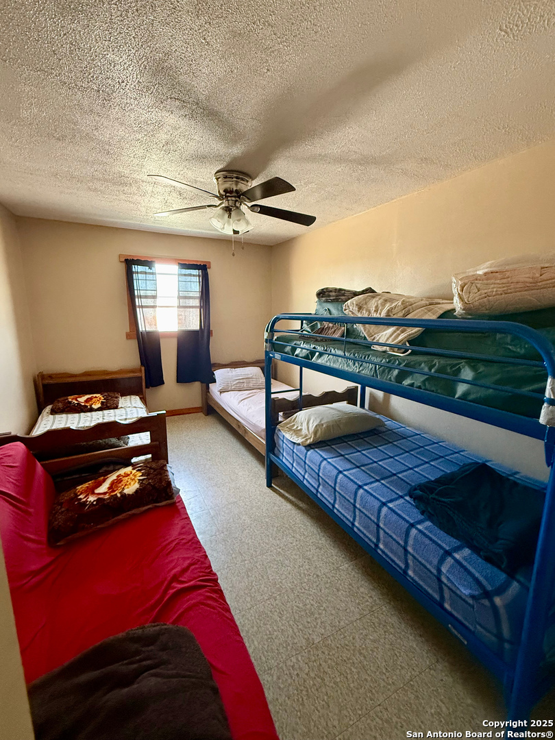Tbd Other Sanderson, TX 79848 - Photo 7 of 36 a bedroom with a bed and a chandelier