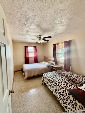 a bedroom with bed and window