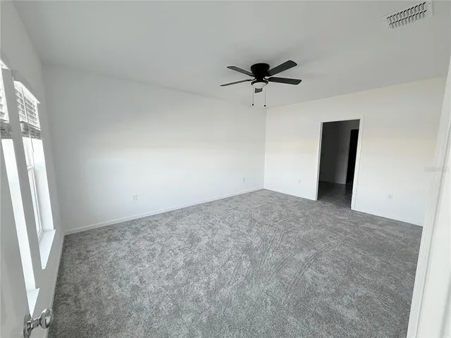 a view of a big room with carpet