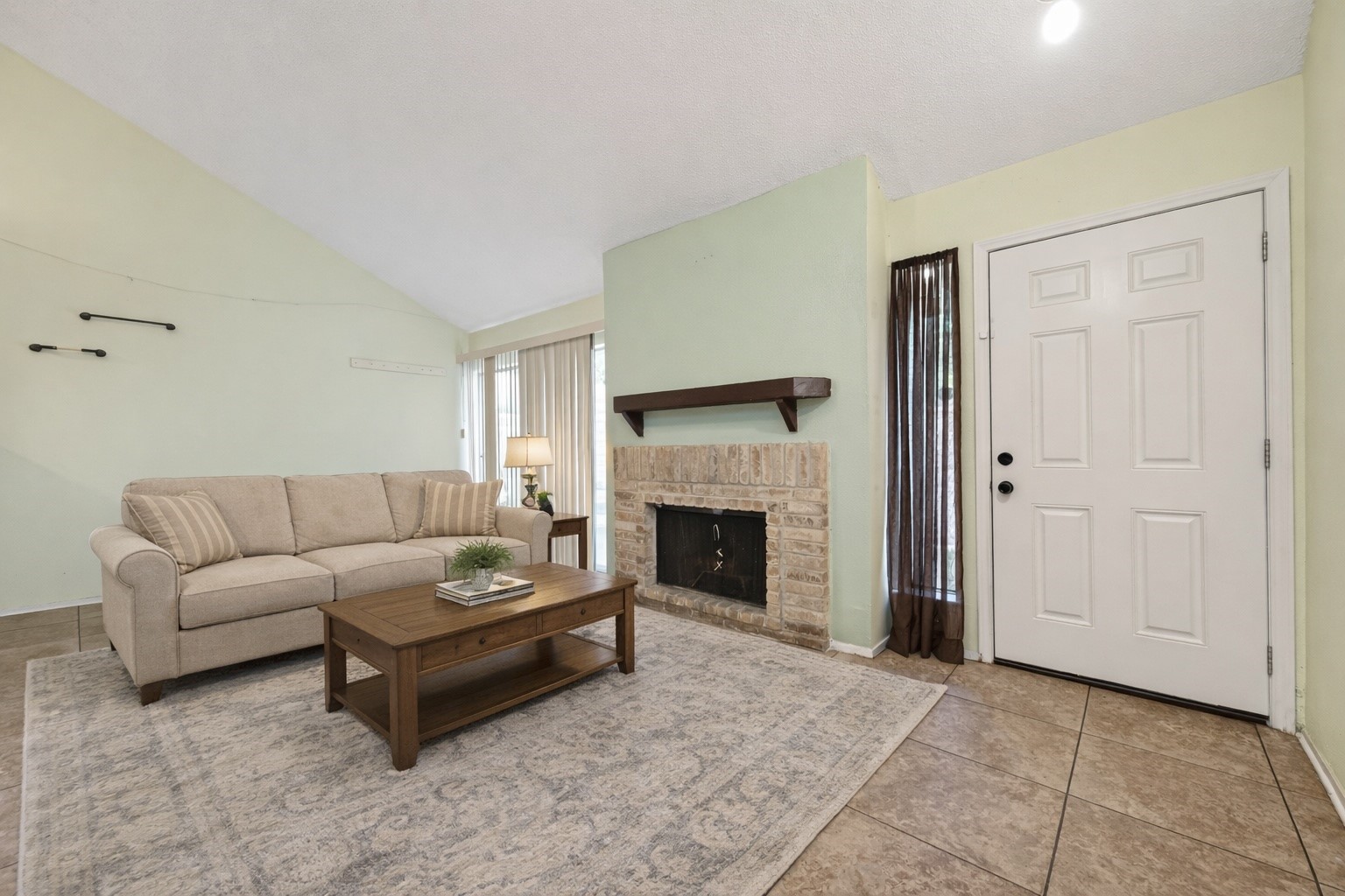 7082 Greenway Chase Street Houston, TX 77072 - Photo 11 of 43 a living room with furniture and a fireplace