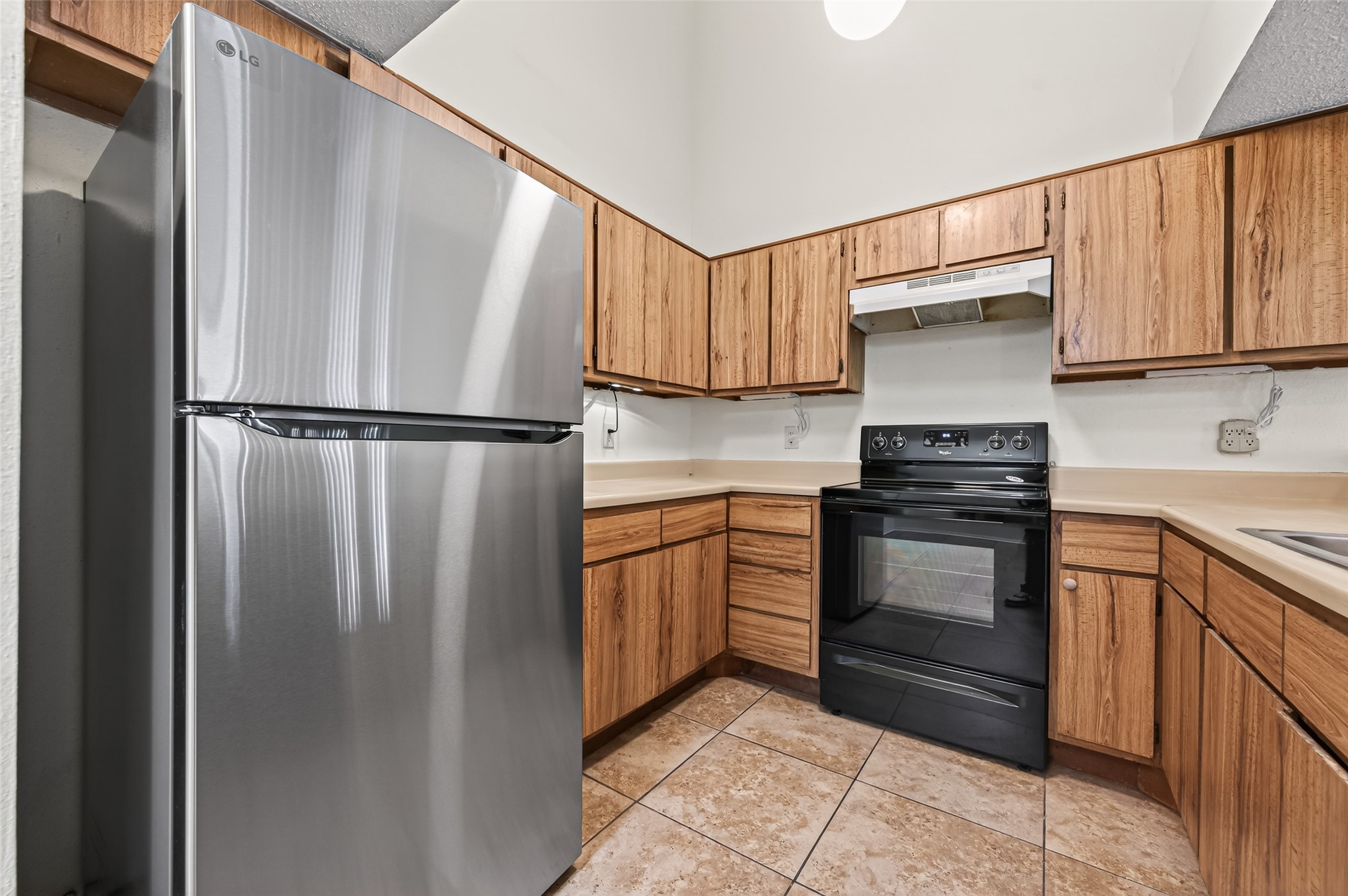 7082 Greenway Chase Street Houston, TX 77072 - Photo 24 of 43 a kitchen with stainless steel appliances granite countertop a refrigerator sink and cabinets