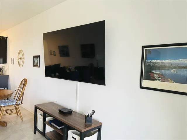 an aerial view of residential houses with outdoor space and swimming pool