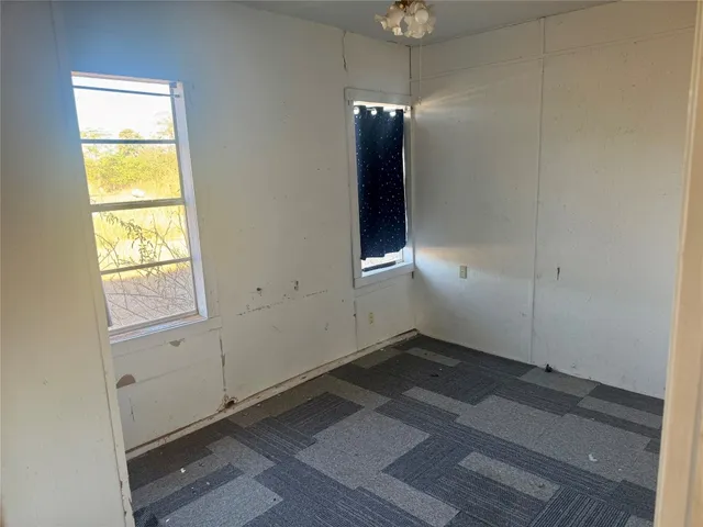 a view of an empty room and window