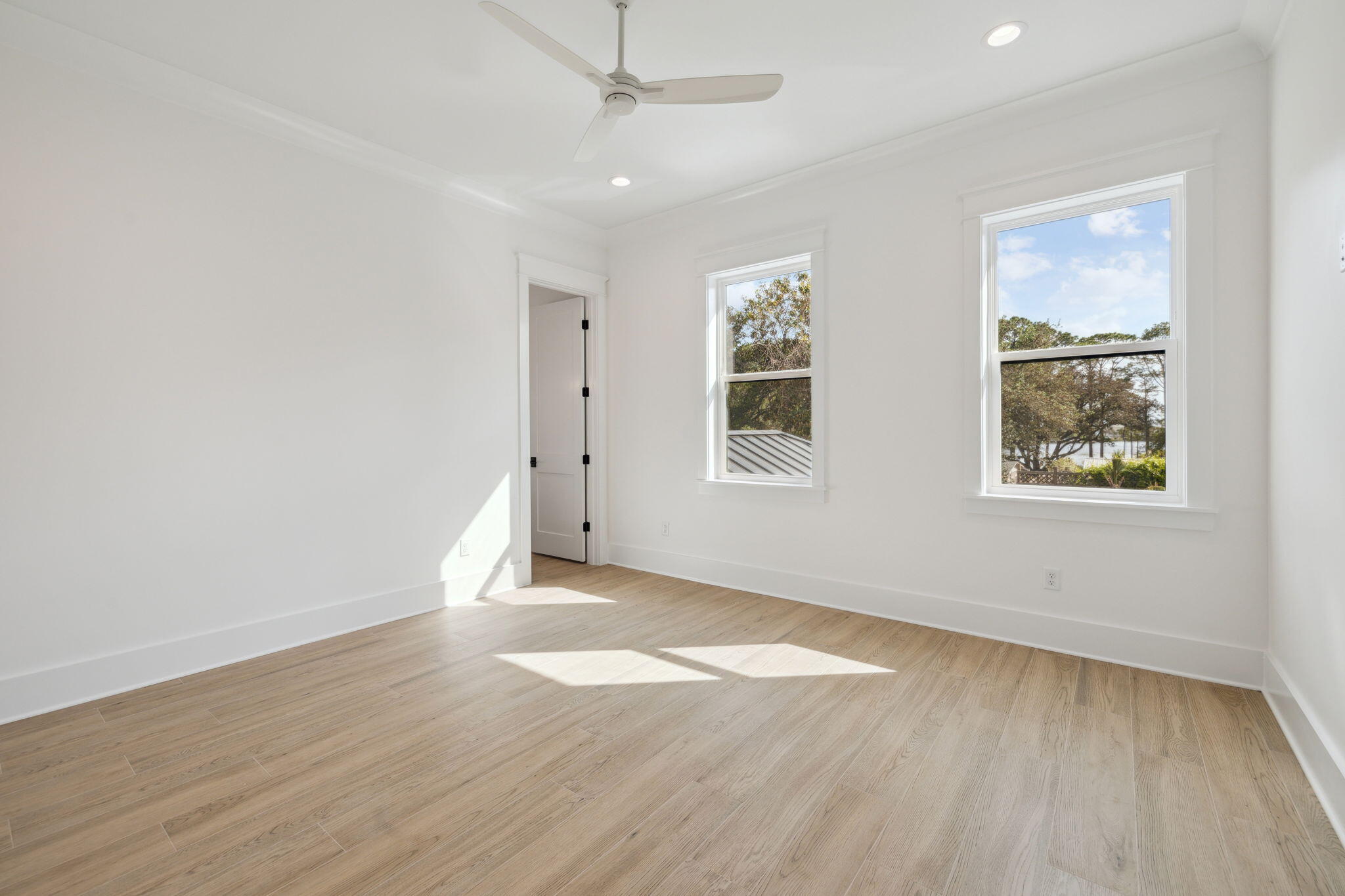 111 Dolphin Drive Santa Rosa Beach, FL 32459 - Photo 18 of 21 an empty room with wooden floor and windows
