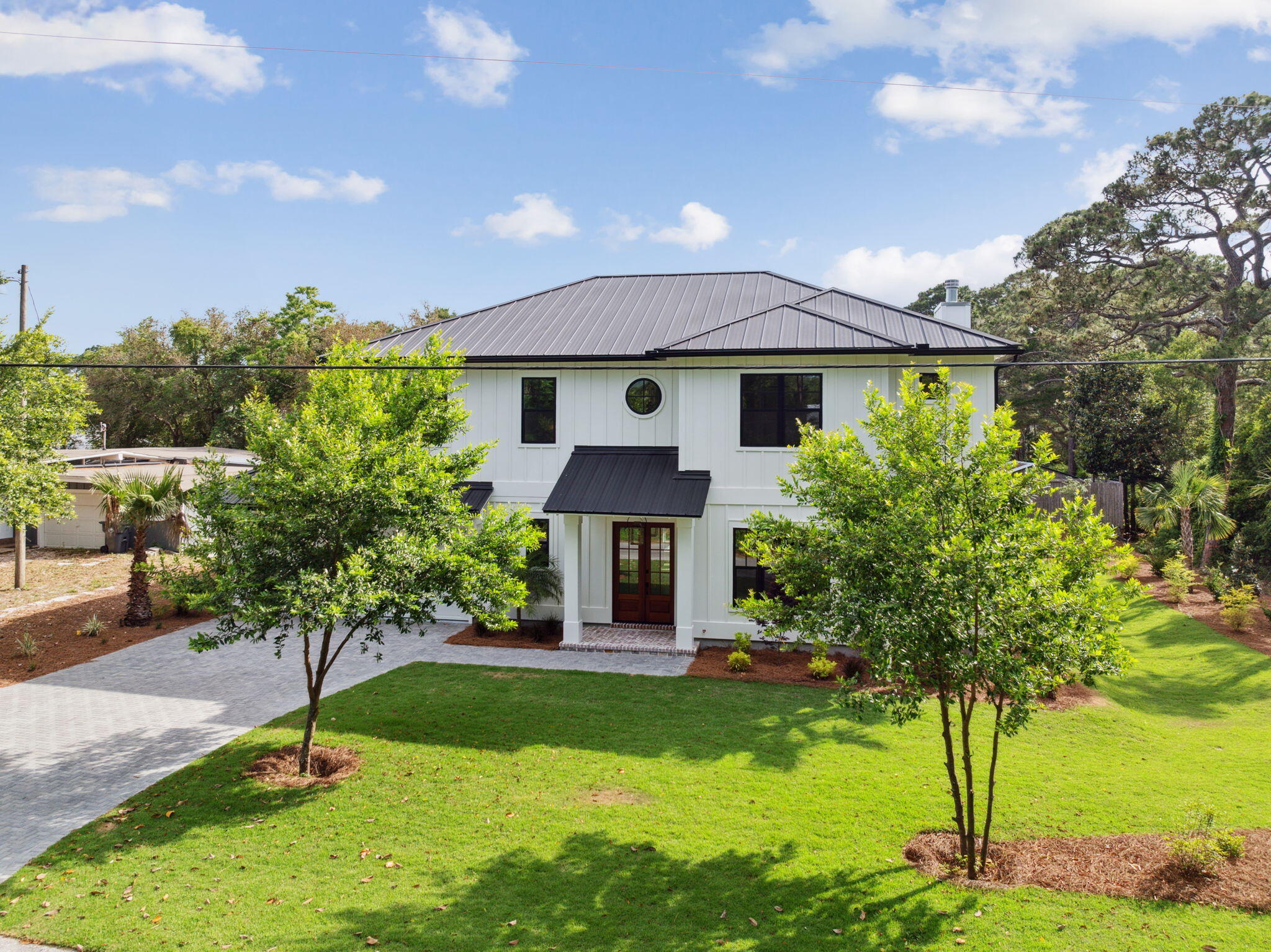 111 Dolphin Drive Santa Rosa Beach, FL 32459 - Photo 3 of 21 a front view of a house with garden