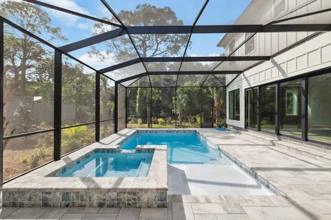 a house view with a sitting space and glass windows