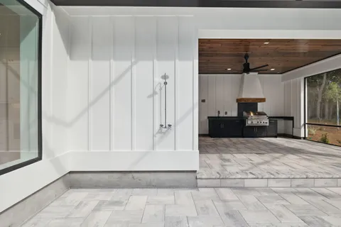 a kitchen with granite countertop a stove top oven
