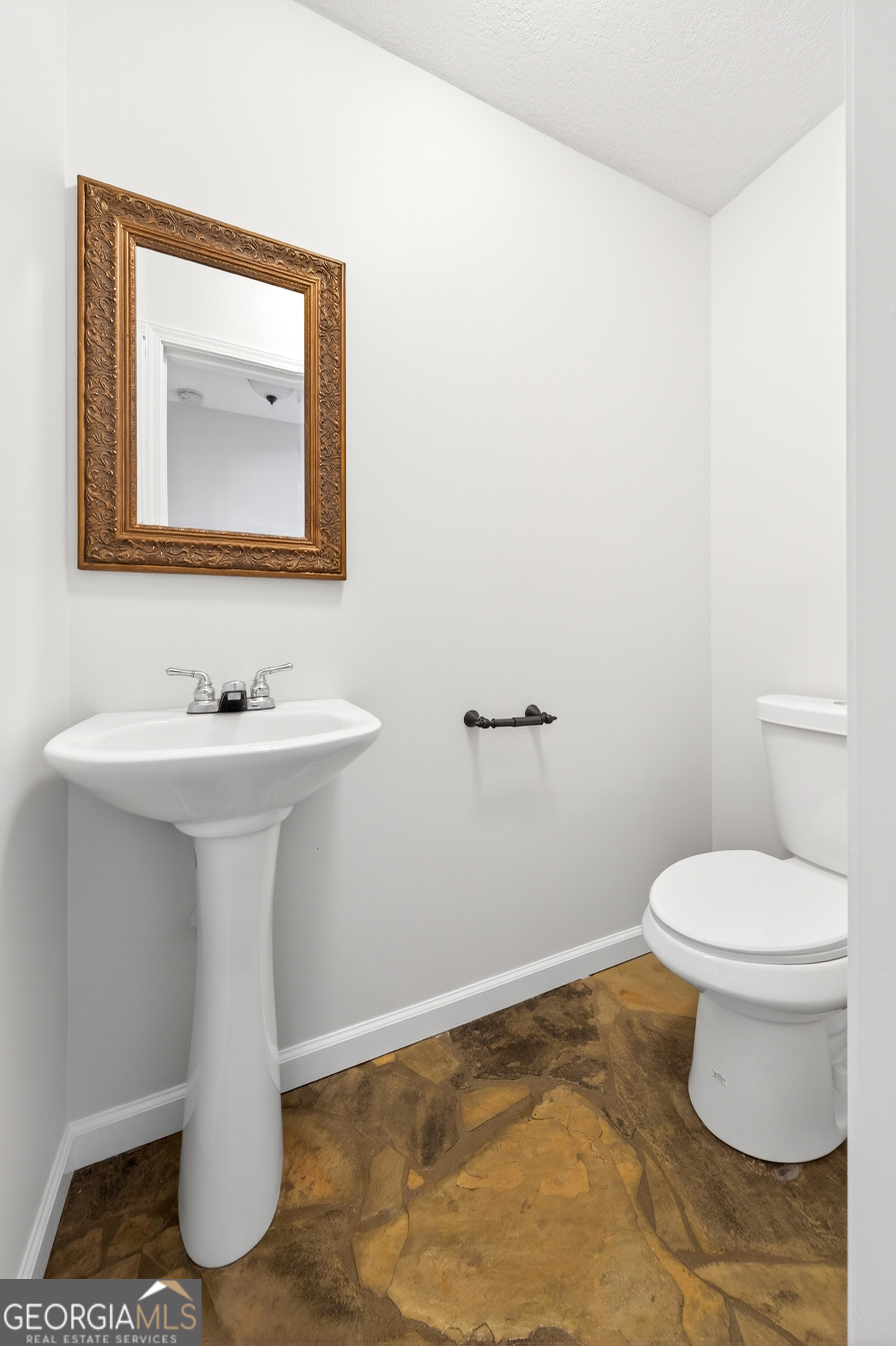 1211 Parham Town Road Bowman, GA 30624 - Photo 13 of 86 a bathroom with a sink toilet and mirror