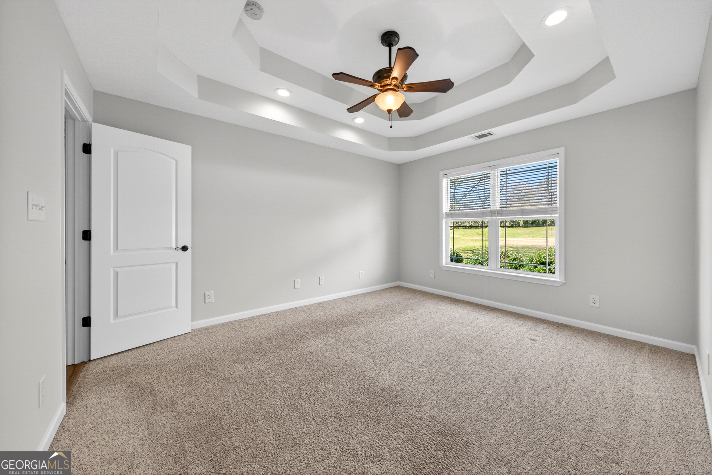 1211 Parham Town Road Bowman, GA 30624 - Photo 15 of 86 a view of a livingroom with a ceiling fan and window