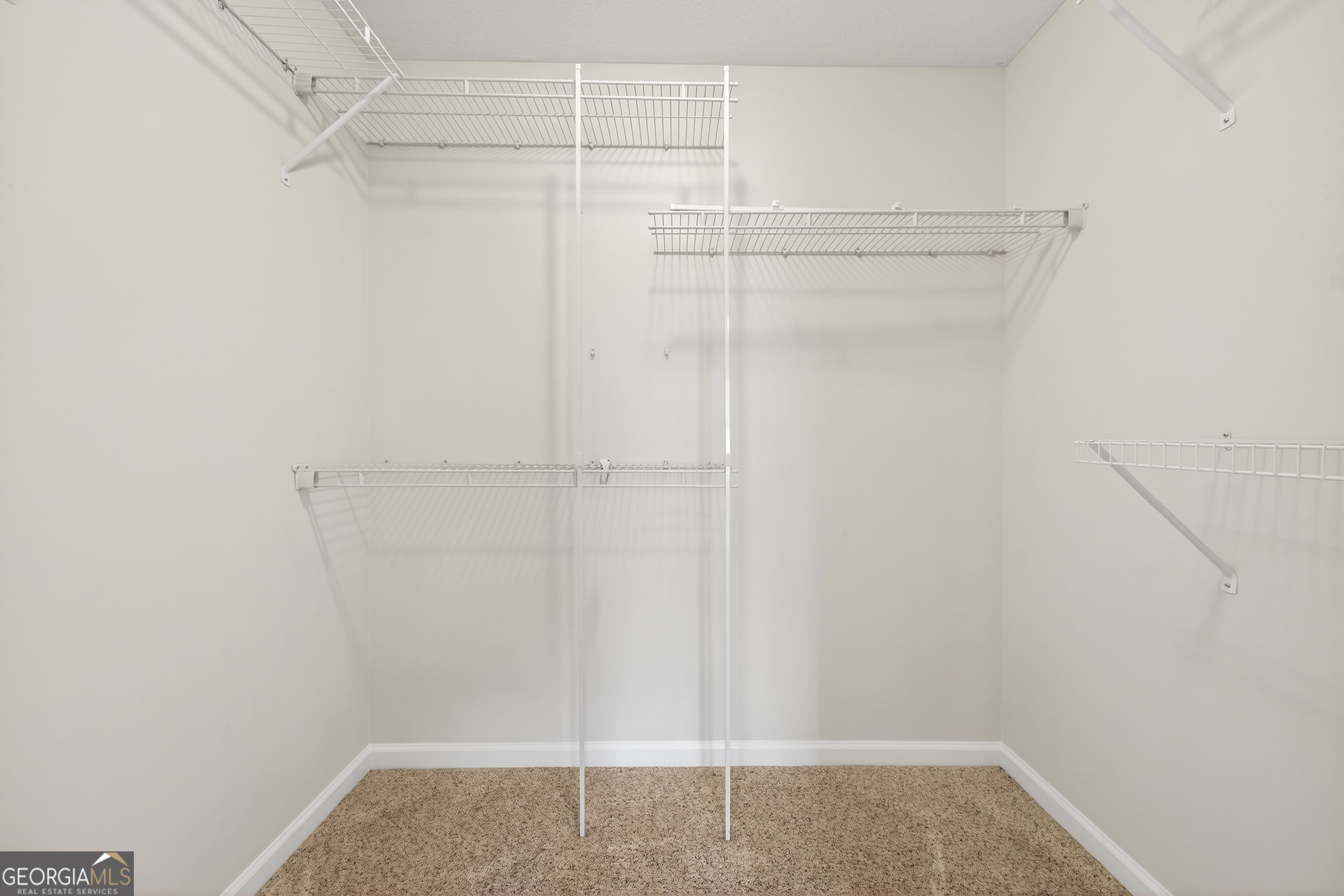 1211 Parham Town Road Bowman, GA 30624 - Photo 17 of 86 a view of walk in closet with clothes