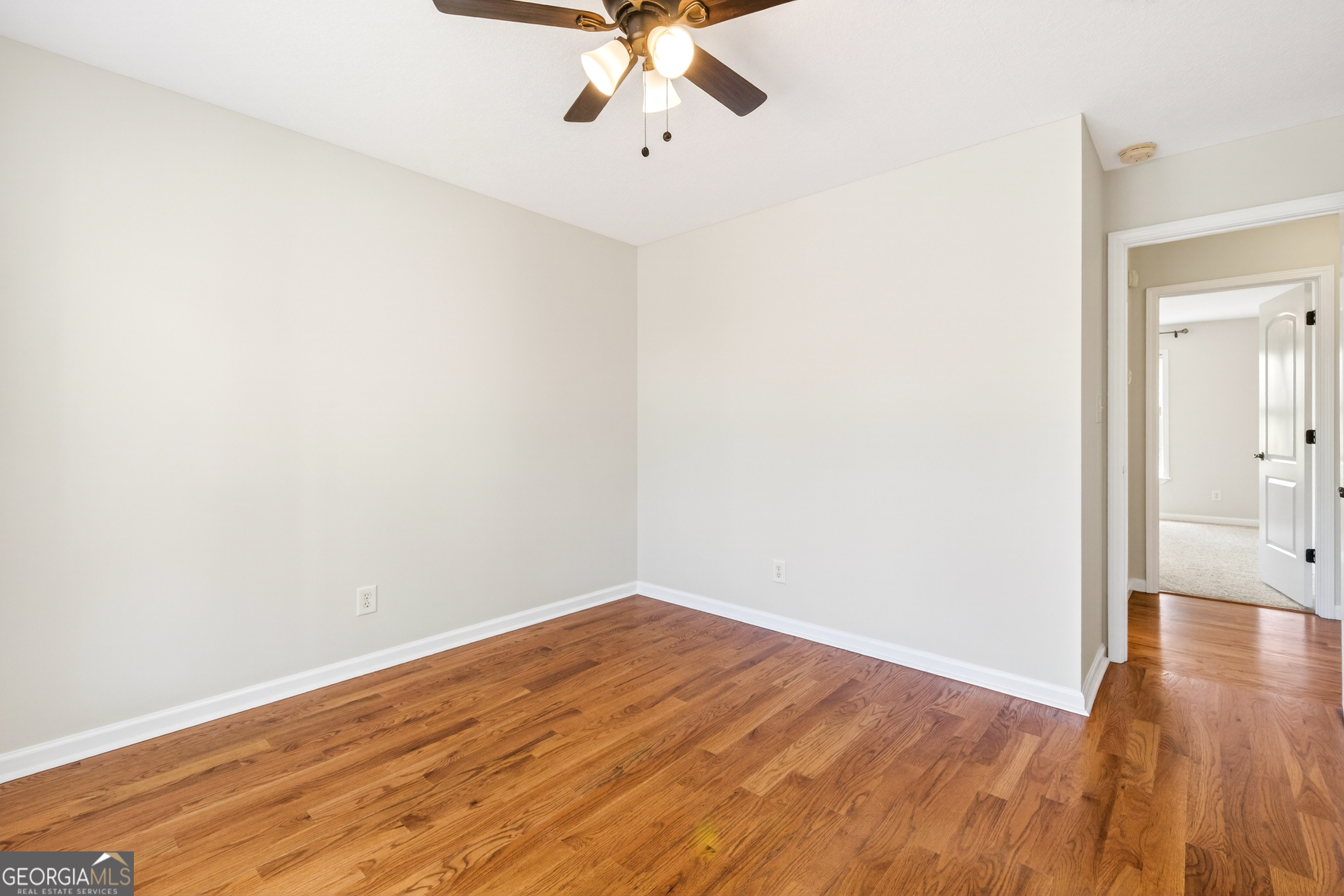 1211 Parham Town Road Bowman, GA 30624 - Photo 33 of 86 a view of an empty room with wooden floor