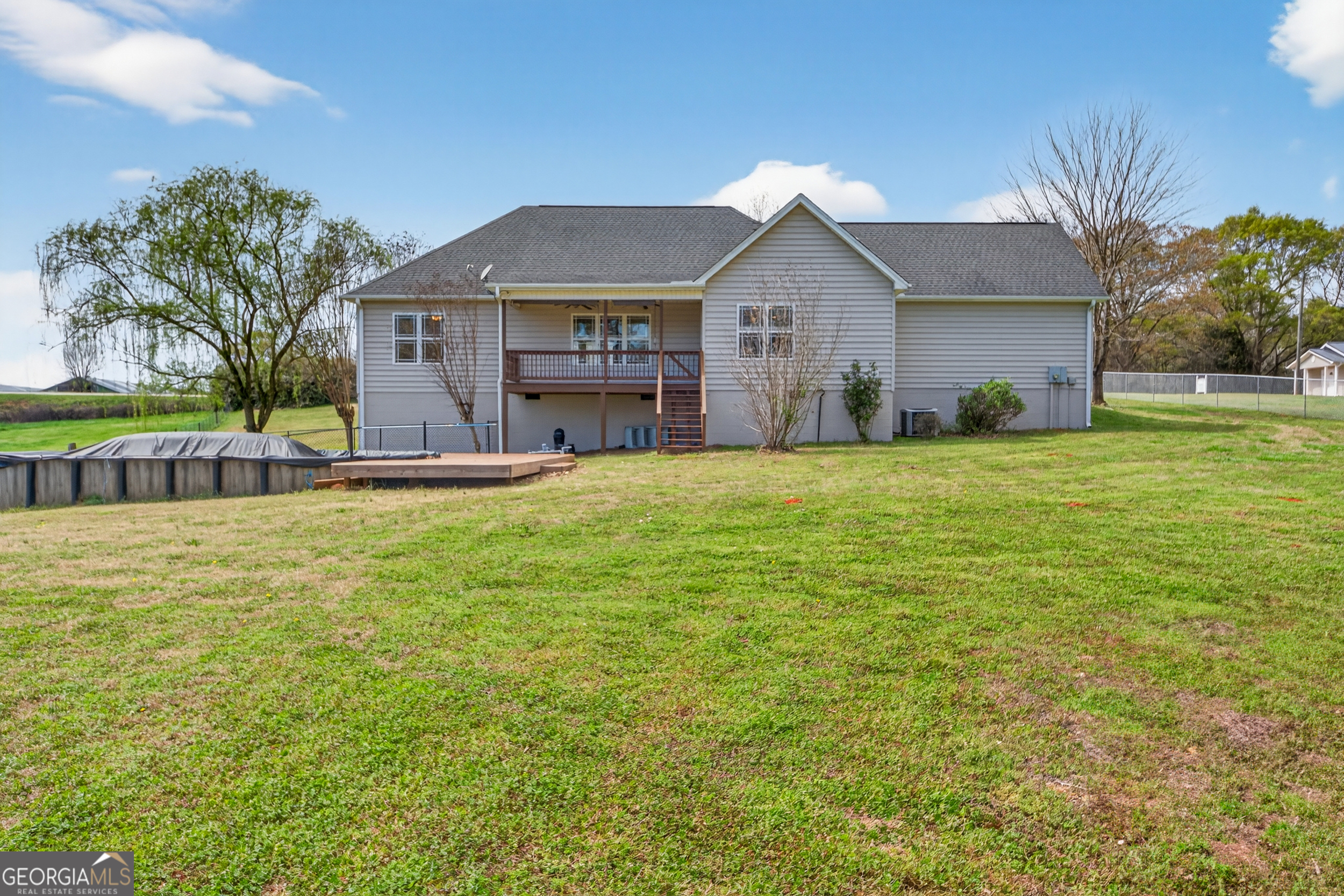 1211 Parham Town Road Bowman, GA 30624 - Photo 45 of 86 a front view of house with yard and car parked