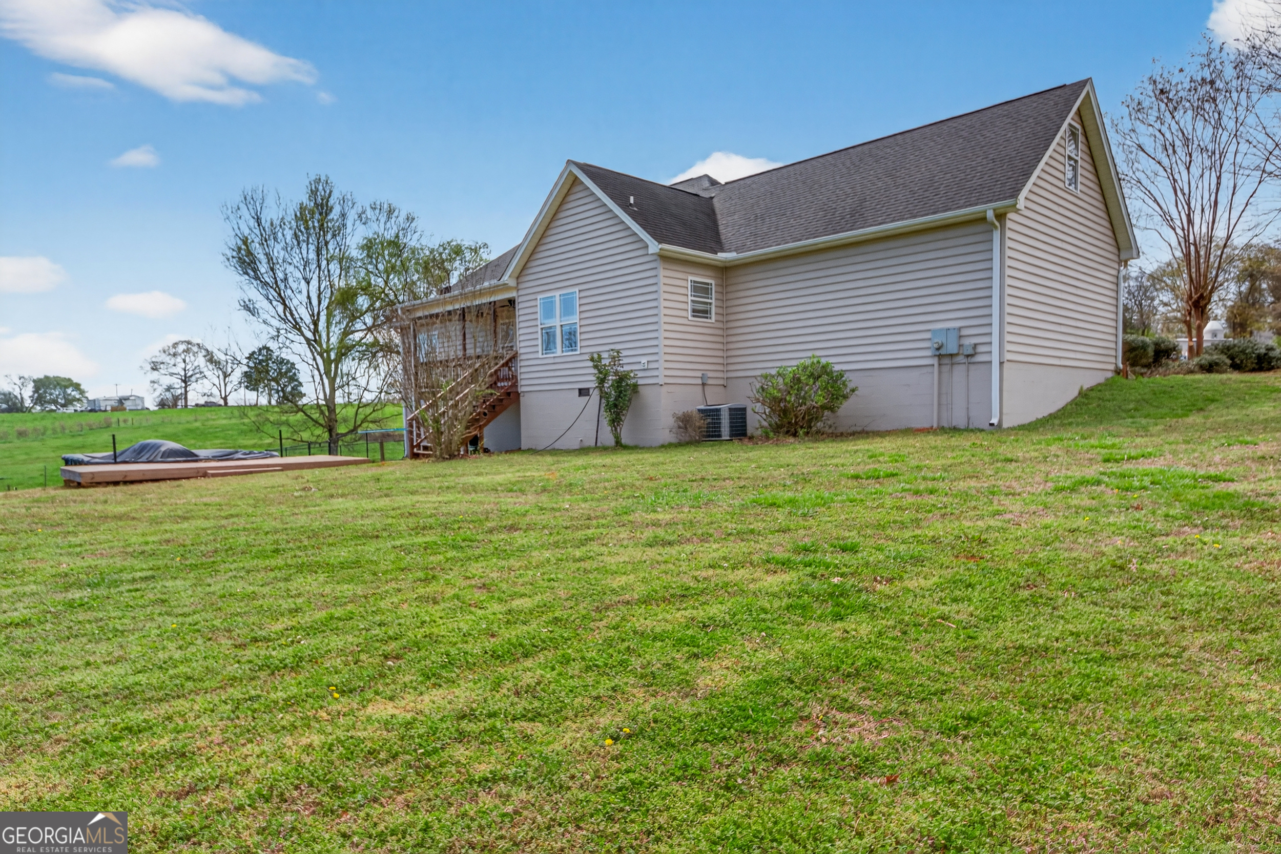 1211 Parham Town Road Bowman, GA 30624 - Photo 46 of 86 a view of a house with a yard