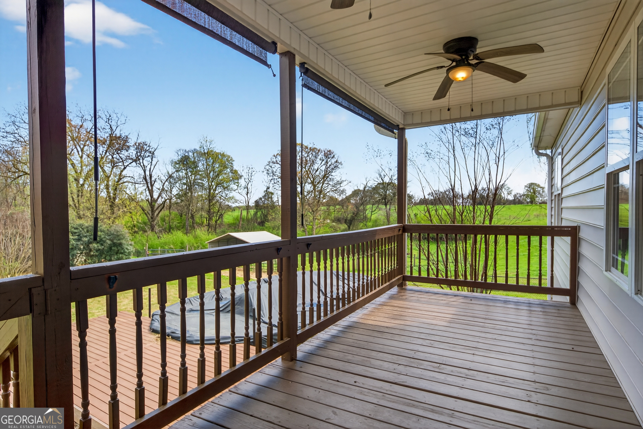 1211 Parham Town Road Bowman, GA 30624 - Photo 49 of 86 a view of a porch with wooden floor