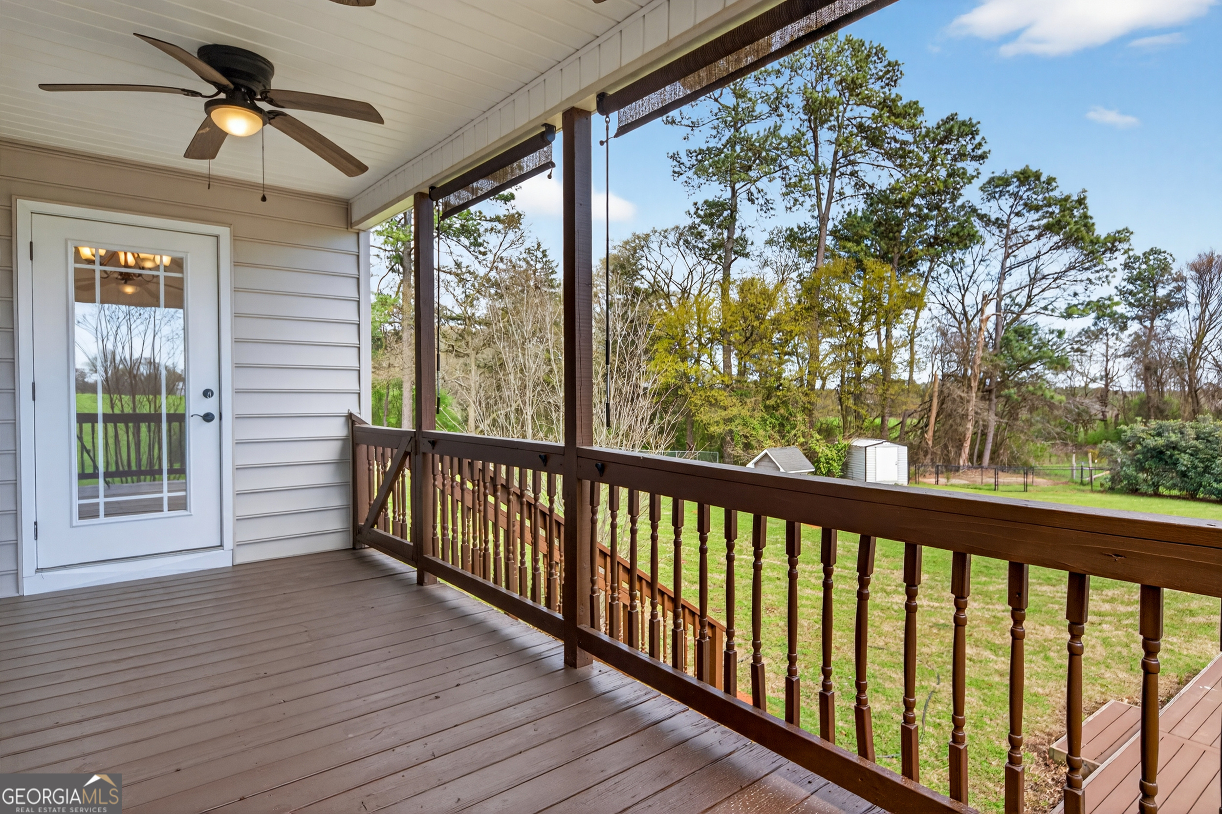 1211 Parham Town Road Bowman, GA 30624 - Photo 50 of 86 a view of a porch with wooden floor and outdoor space