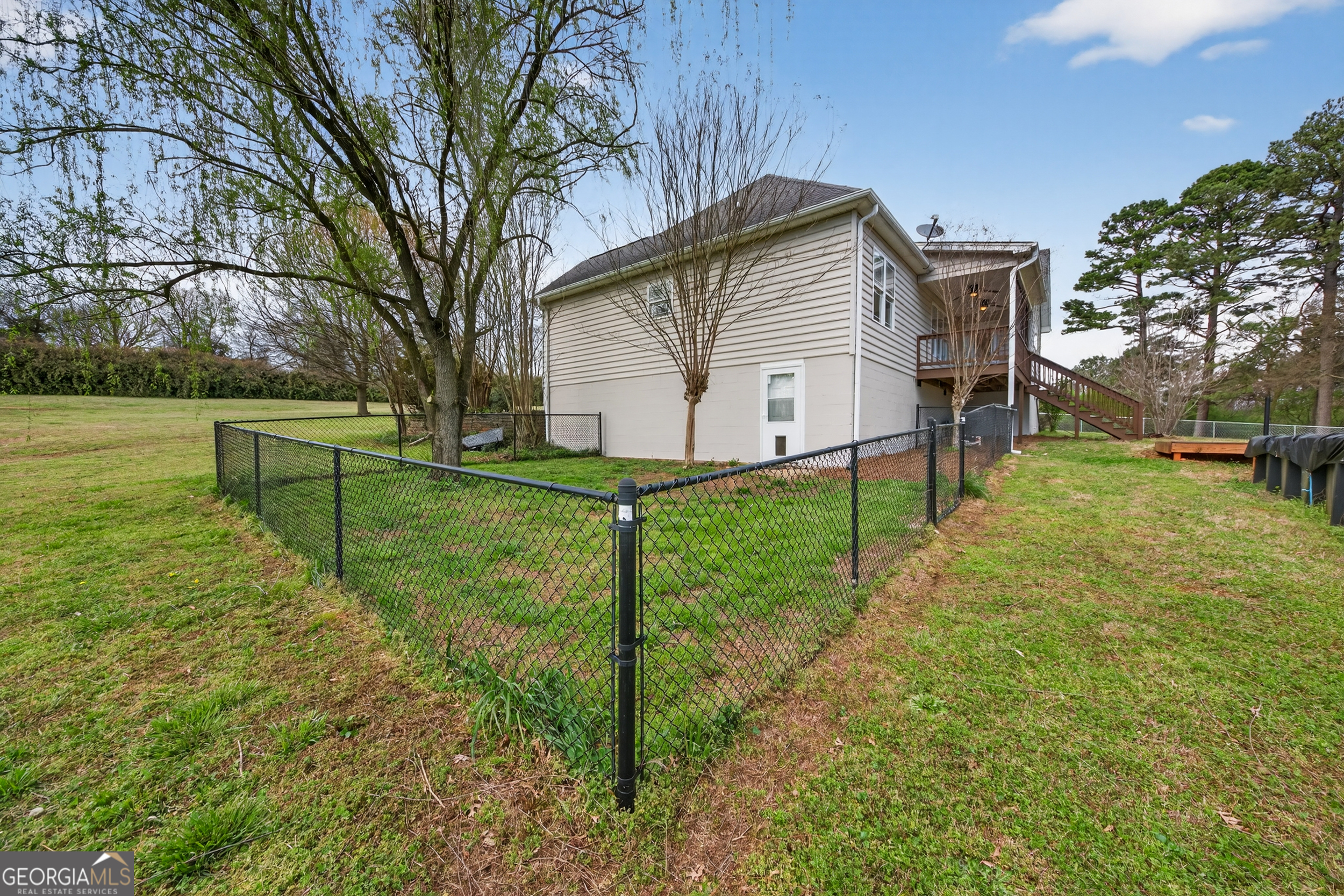 1211 Parham Town Road Bowman, GA 30624 - Photo 51 of 86 a view of backyard with wooden fence