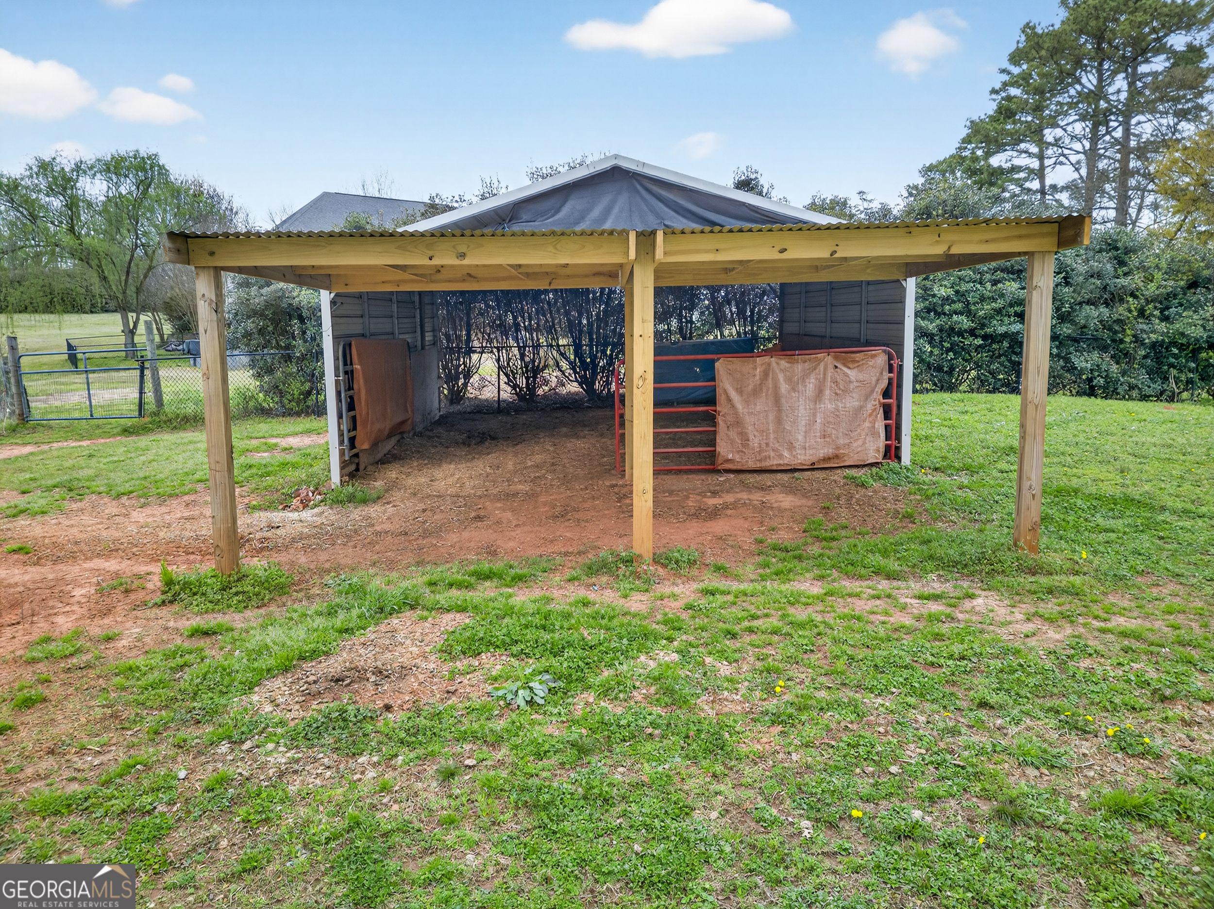 1211 Parham Town Road Bowman, GA 30624 - Photo 52 of 86 a view of a house with backyard and porch