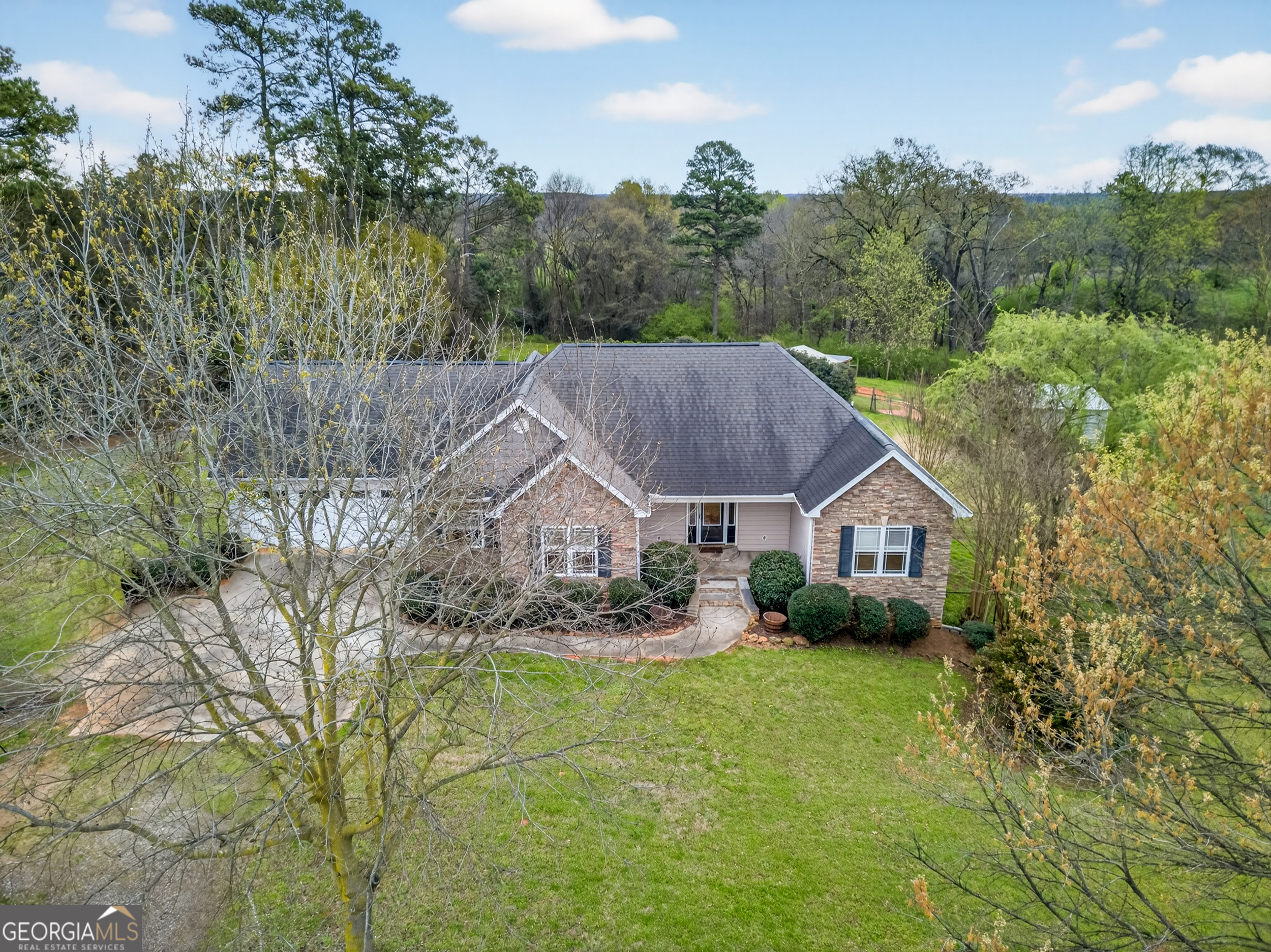 1211 Parham Town Road Bowman, GA 30624 - Photo 61 of 86 a view of a house with a big yard plants and large trees