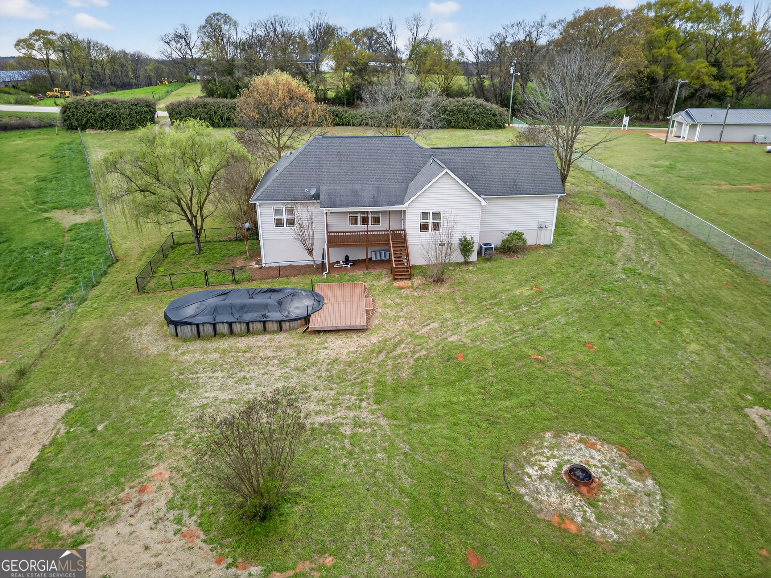 1211 Parham Town Road Bowman, GA 30624 - Photo 64 of 86 a aerial view of a house with a big yard