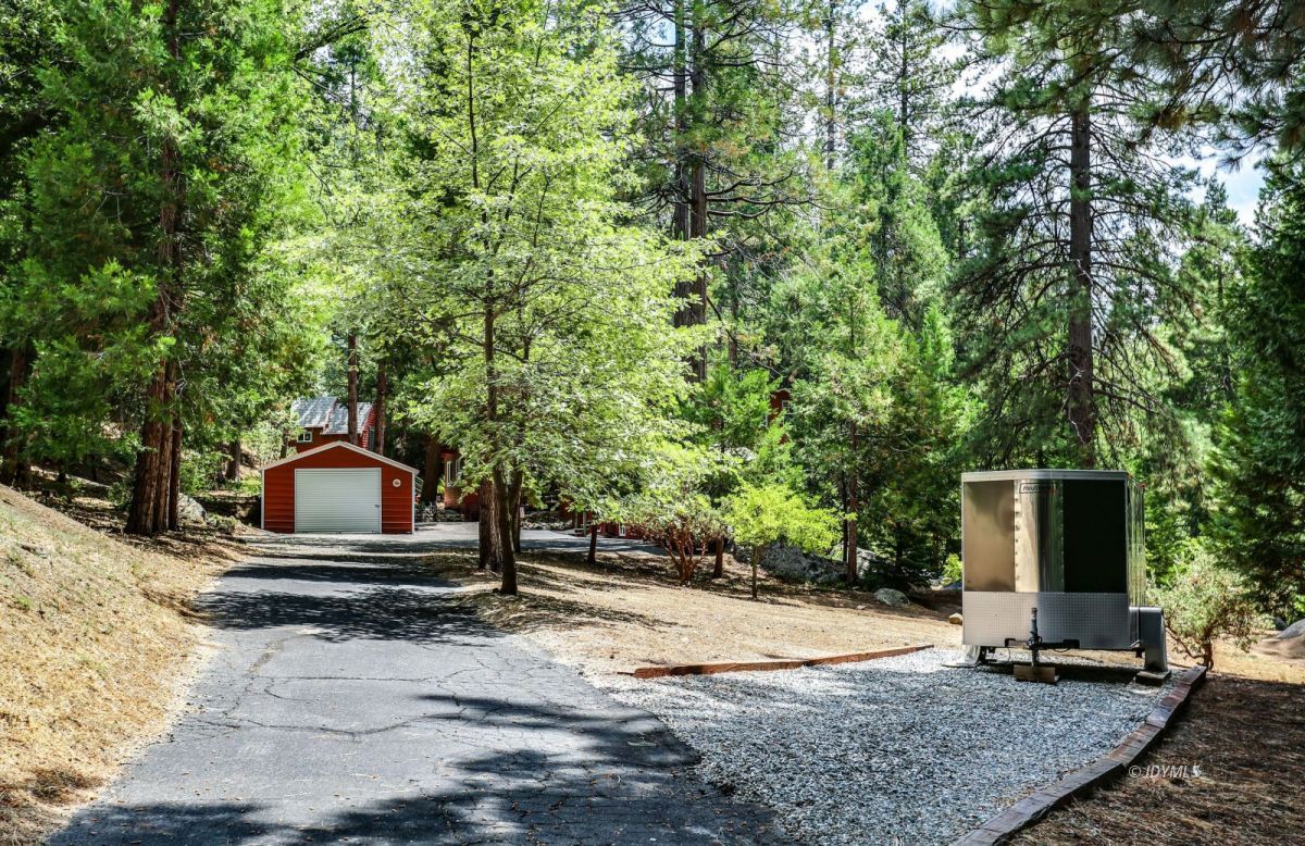 25891 Wayne Road Idyllwild, CA 92549 - Photo 3 of 72 a white house that has a tree in front of it