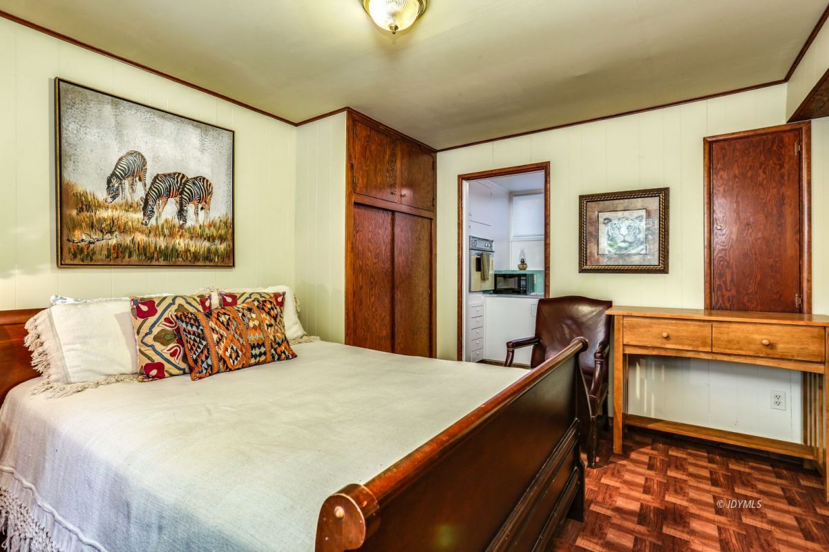 25891 Wayne Road Idyllwild, CA 92549 - Photo 42 of 72 a bedroom with a bed and paintings on the wall