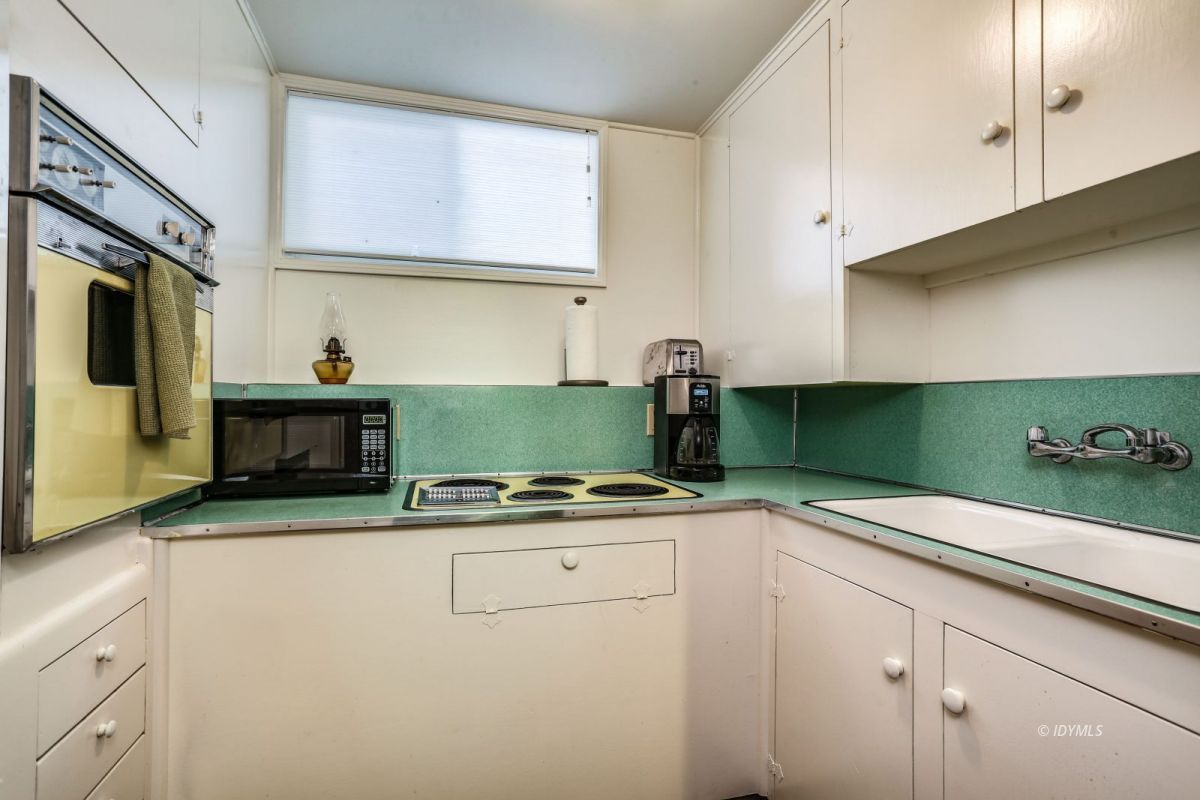 25891 Wayne Road Idyllwild, CA 92549 - Photo 43 of 72 a kitchen with granite countertop a sink cabinets and stainless steel appliances