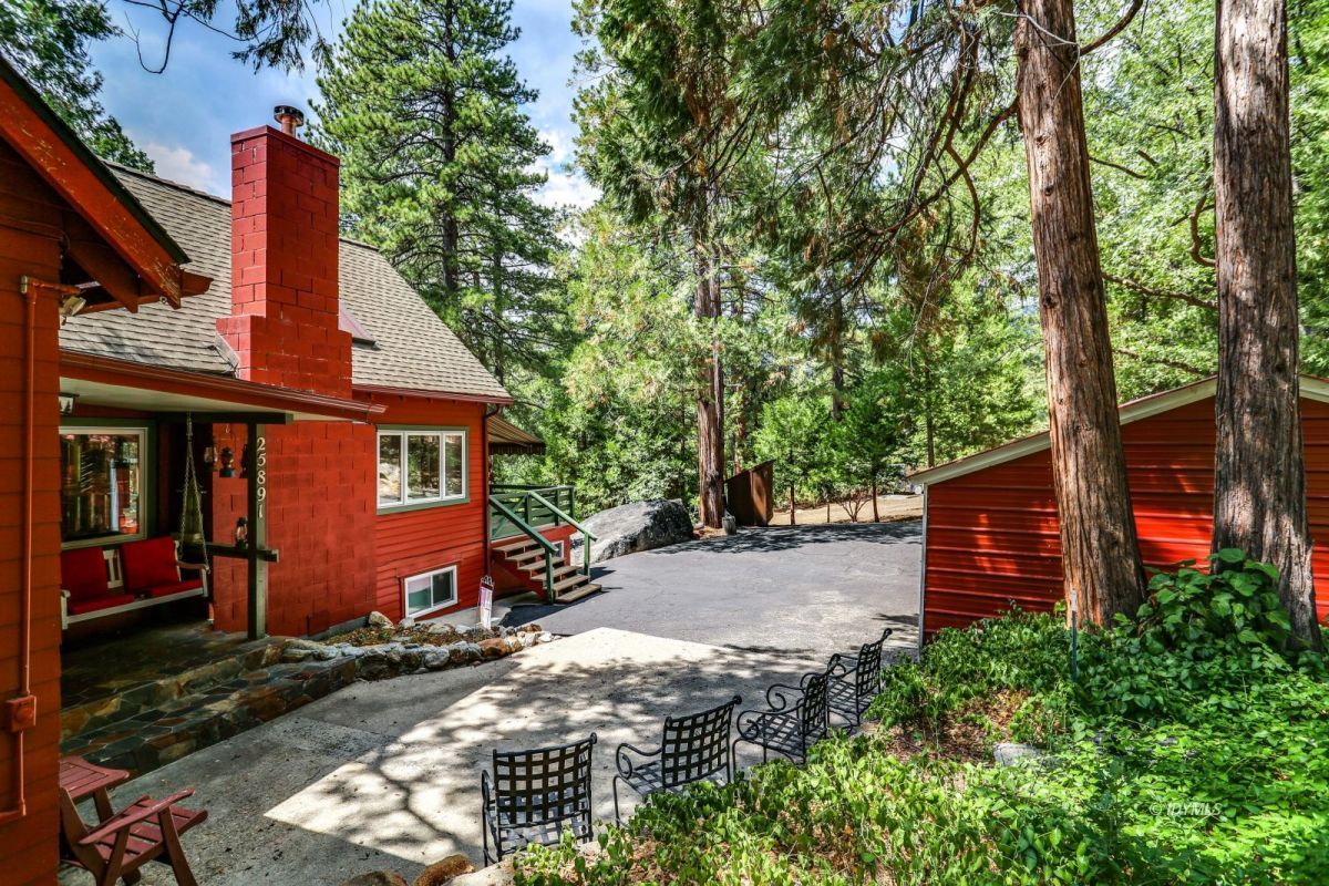 25891 Wayne Road Idyllwild, CA 92549 - Photo 54 of 72 a front view of a house with a garden