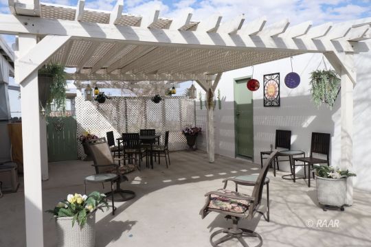400 North Norma Street Ridgecrest, CA 93555 - Photo 4 of 20 a dining room with furniture and a chandelier