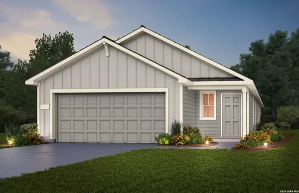 a view of a house with a yard and garage