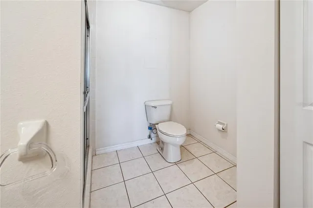 a spacious bathroom with a shower sink and mirror