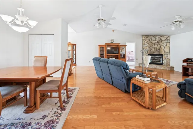 a kitchen with stainless steel appliances a sink window and cabinets