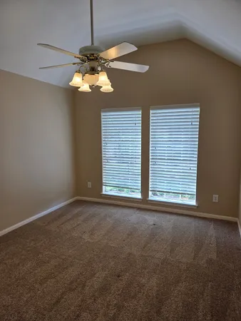 a view of a livingroom with a chandelier fan