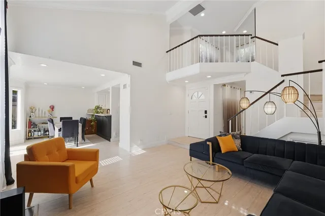 a living room with furniture a couch and a flat screen tv