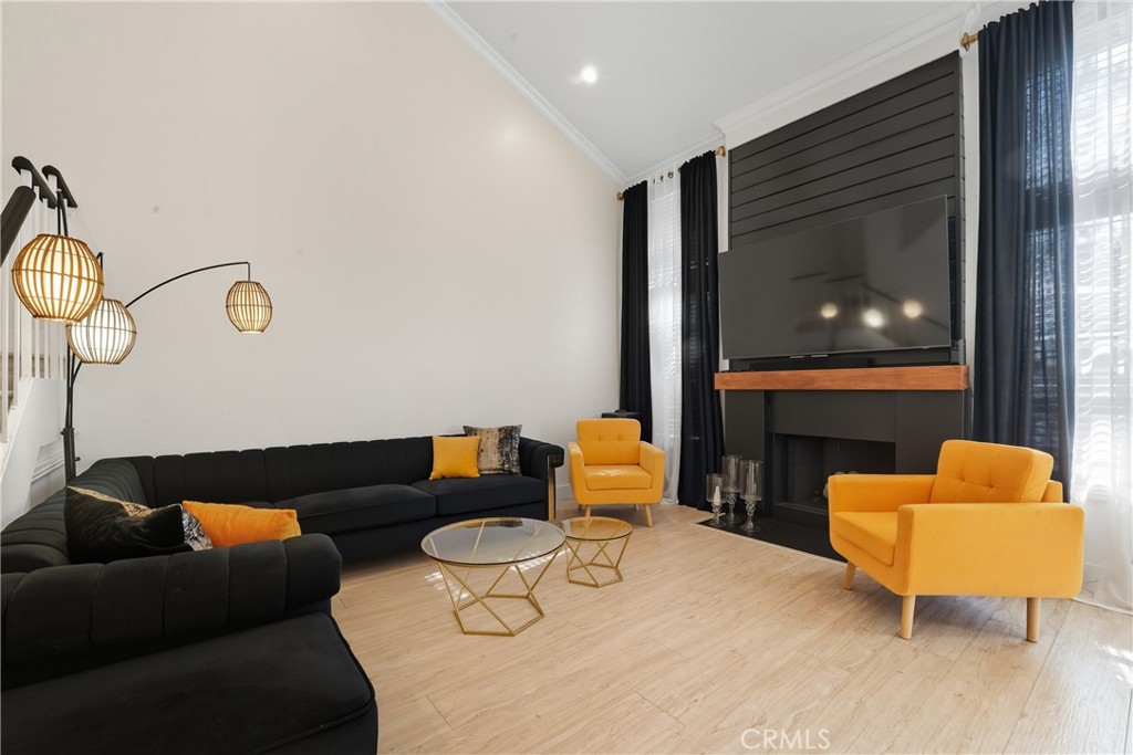 6070 East Summit Court Anaheim Hills, CA 92807 - Photo 19 of 60 a living room with furniture and a fireplace