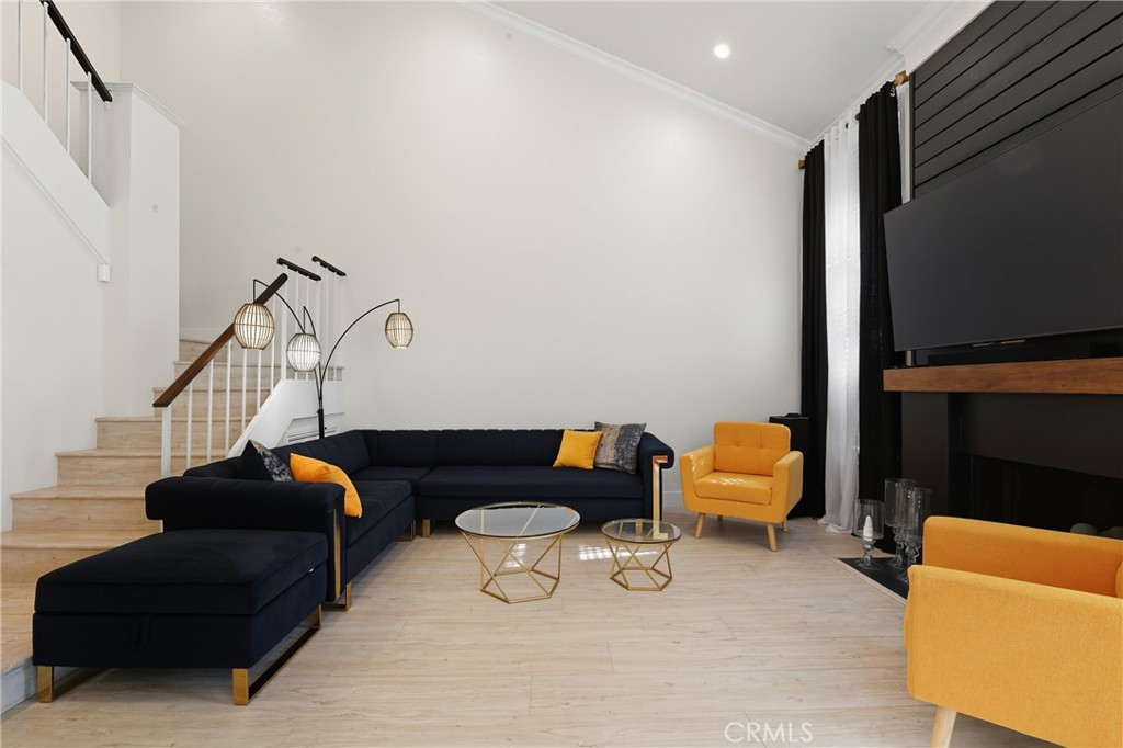 6070 East Summit Court Anaheim Hills, CA 92807 - Photo 20 of 60 a living room with furniture a couch and a flat screen tv