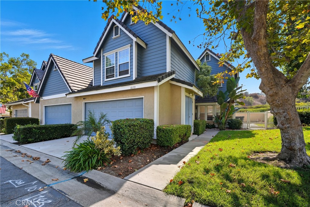 6070 East Summit Court Anaheim Hills, CA 92807 - Photo 2 of 60 a front view of a house with garden