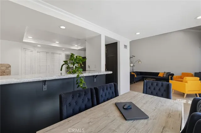 a kitchen with a refrigerator and cabinets