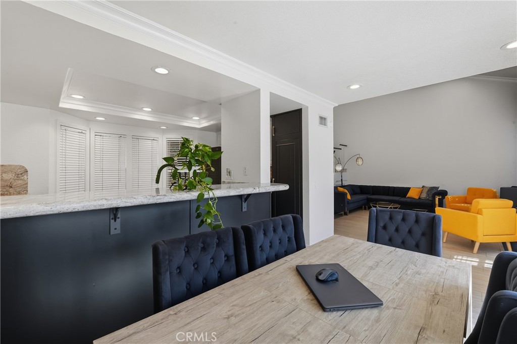 6070 East Summit Court Anaheim Hills, CA 92807 - Photo 23 of 60 a kitchen with stainless steel appliances kitchen island granite countertop a sink a stove a counter top space and cabinets