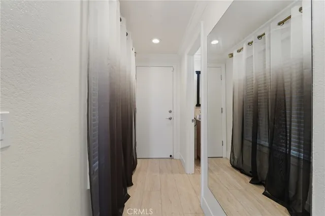 a view of living room with furniture and a fireplace