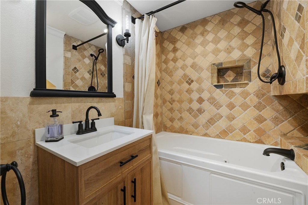 6070 East Summit Court Anaheim Hills, CA 92807 - Photo 30 of 60 a bathroom with a sink and a bathtub