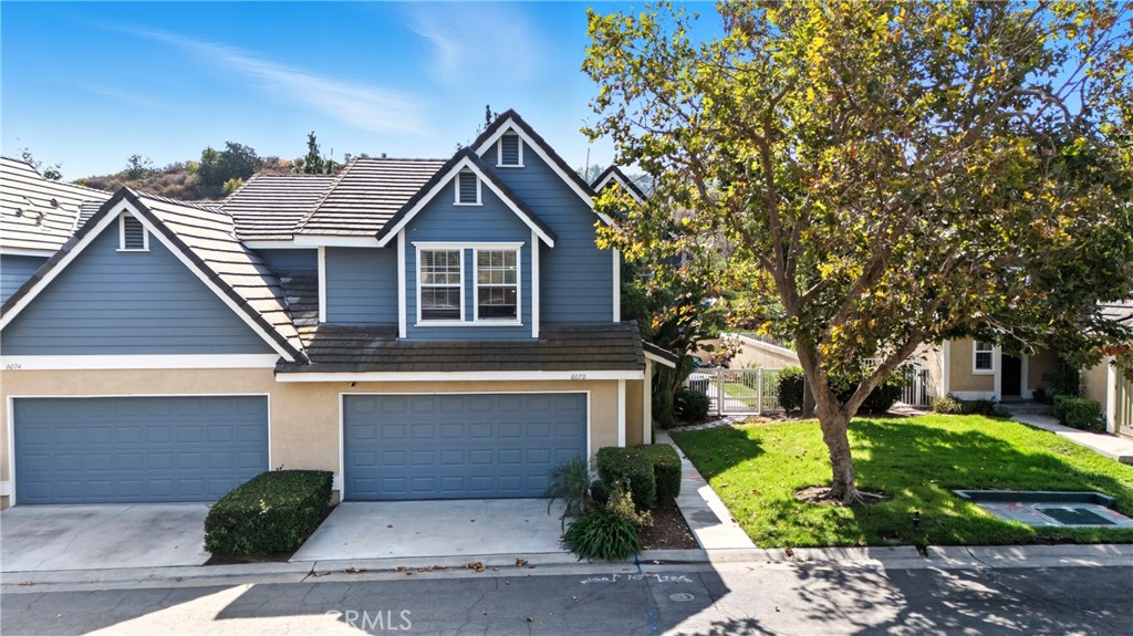 6070 East Summit Court Anaheim Hills, CA 92807 - Photo 3 of 60 a front view of a house with garden