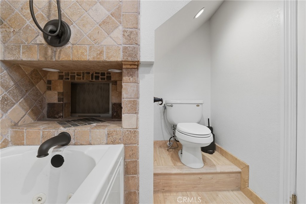 6070 East Summit Court Anaheim Hills, CA 92807 - Photo 33 of 60 a bathroom with a toilet and a sink