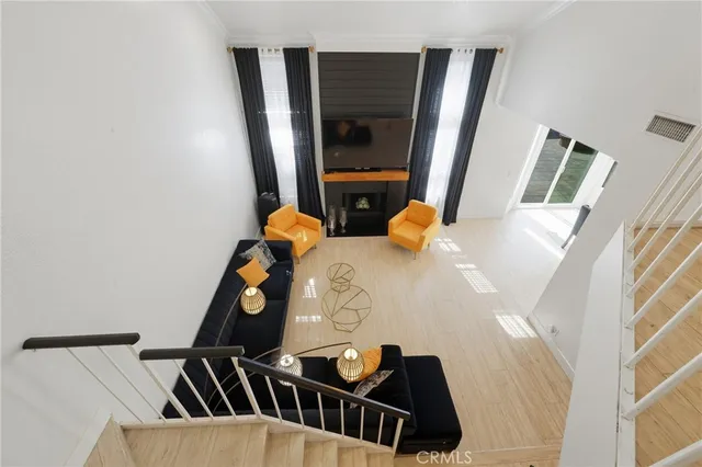 a spacious bedroom with a bed and a dresser