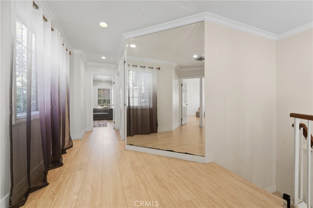 6070 East Summit Court Anaheim Hills, CA 92807 - Photo 36 of 60 a view of a hallway with wooden floor