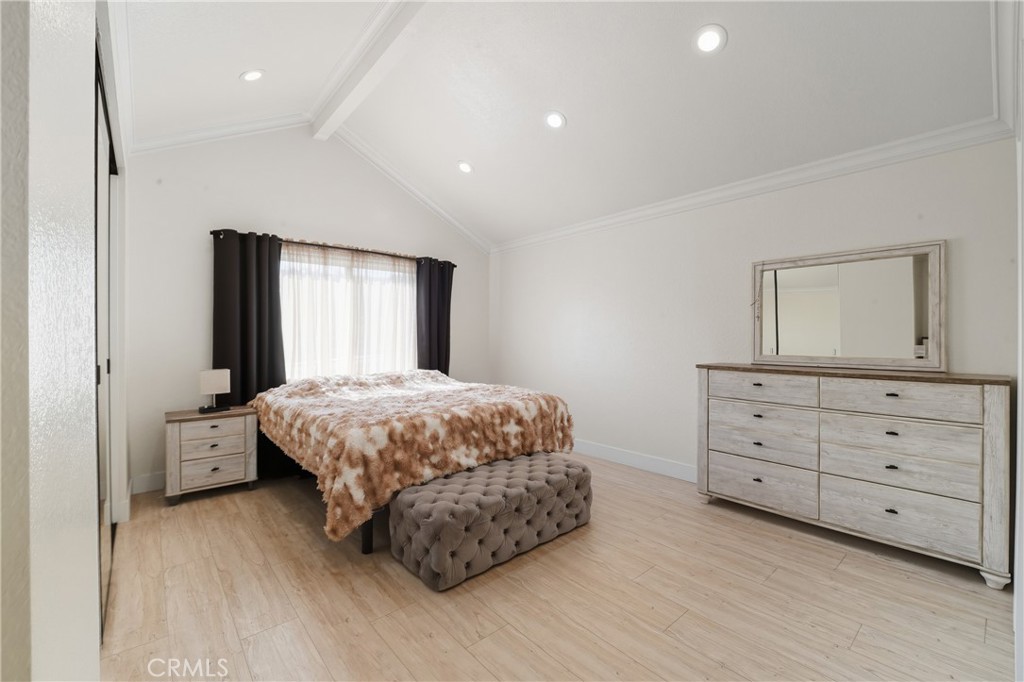 6070 East Summit Court Anaheim Hills, CA 92807 - Photo 38 of 60 a spacious bedroom with a large bed and a dresser