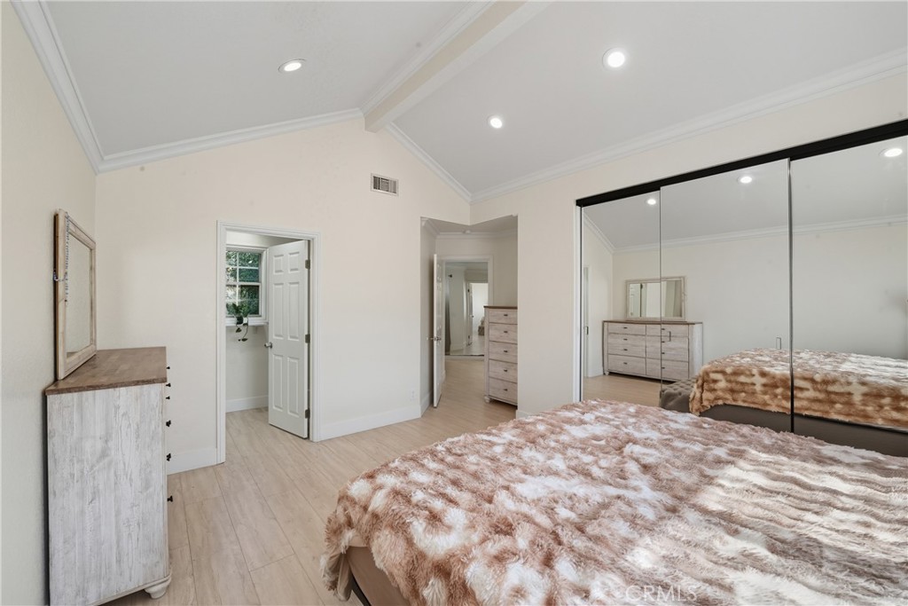 6070 East Summit Court Anaheim Hills, CA 92807 - Photo 40 of 60 a spacious bedroom with a bed and a dresser