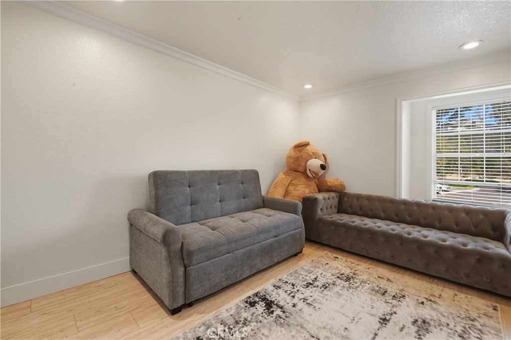 6070 East Summit Court Anaheim Hills, CA 92807 - Photo 43 of 60 a living room with furniture and a window